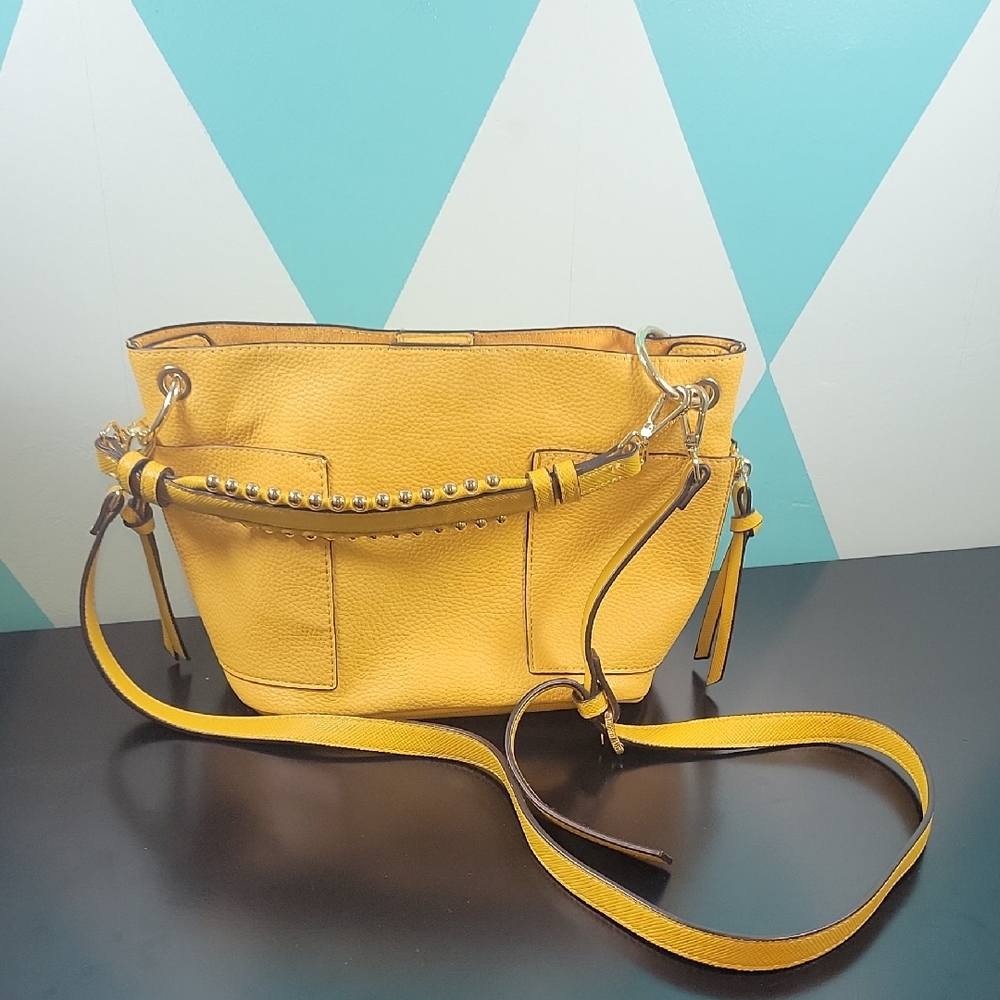 Steve Madden Bsammy faux leather bucket bag in yellow with gold-toned studs